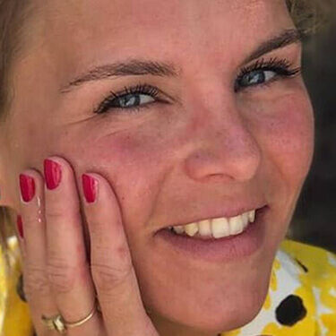 Woman with hand on face