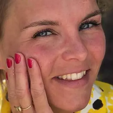 Woman with hand on face
