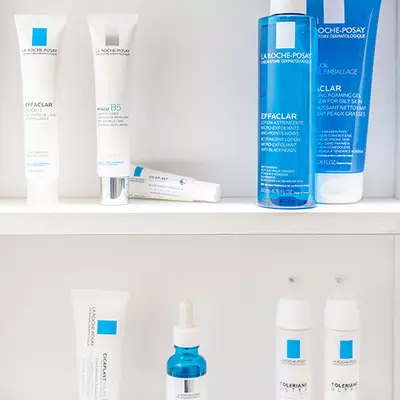A collection of skincare products from La Roche-Posay and Effaclar, including a foaming gel cleanser and various creams, displayed against a light background.