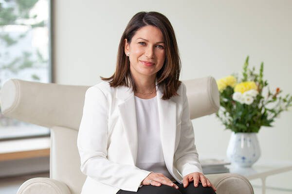 Consultant Dermatologist Dr Hiva Fassihi sitting