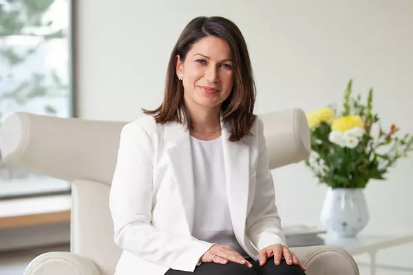 Consultant Dermatologist Dr Hiva Fassihi sitting