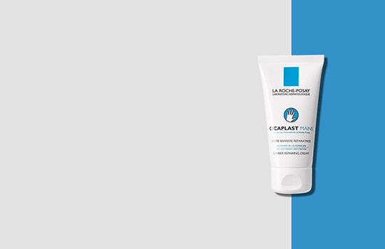 A tube of La Roche-Posay Cicaplast Balm on a split background of light gray and blue.