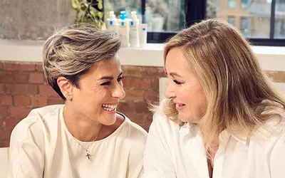 Two women smiling