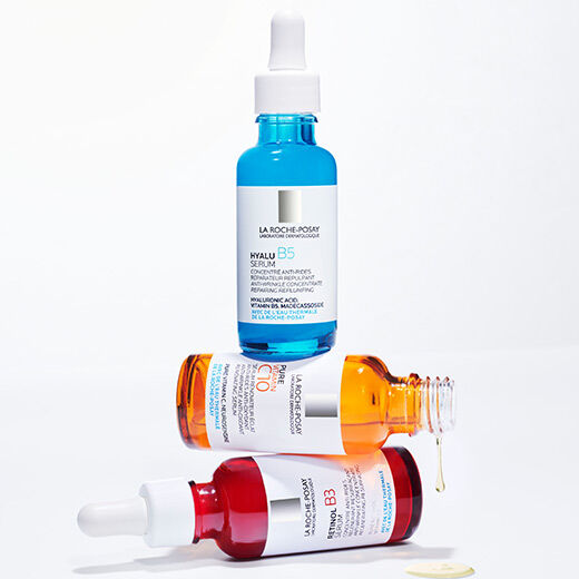 Two bottles of La Roche-Posay skincare serums are stacked on top of each other. The top bottle is labeled "Hyalu B5 Serum," and the bottom bottle is labeled "Pure Vitamin C10 Serum."