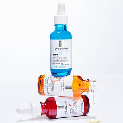 Two bottles of La Roche-Posay skincare serums are stacked on top of each other. The top bottle is labeled "Hyalu B5 Serum," and the bottom bottle is labeled "Pure Vitamin C10 Serum."