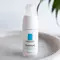 A white skincare bottle of La Roche-Posay's Toleriane Ultra Contour Yeux, featuring a simple blue logo on the front.