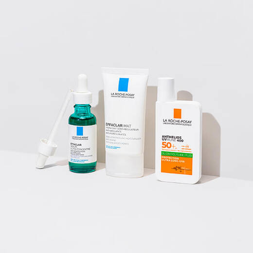 Effaclar Serum, Effaclar Duo(+) and Anthelios UVMune 400 Oil Control standing against a bright white background and on a reflective surface