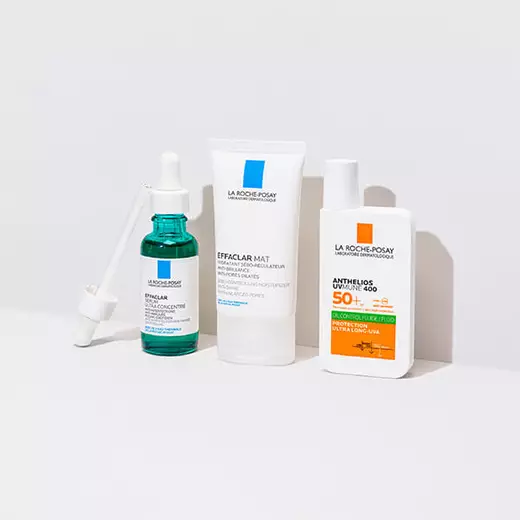 Effaclar Serum, Effaclar Duo(+) and Anthelios UVMune 400 Oil Control standing against a bright white background and on a reflective surface