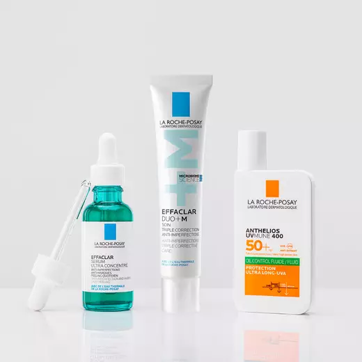 Effaclar Serum, Effaclar Duo(+) and Anthelios UVMune 400 Oil Correct standing against a bright white background and on a reflective surface
