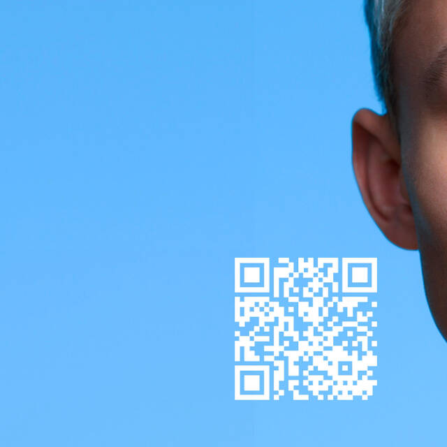 A close-up of a young person's face next to a smartphone displaying a digital representation of their face, with a QR code in the bottom left corner and a solid blue background.