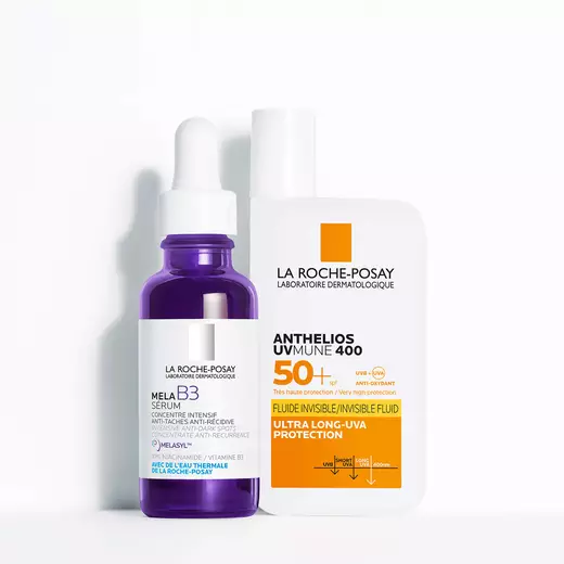 Niacinamide Serum, Toleriane Dermallergo Cream and Anthelio Pigment Correct standing against a bright white background and on a reflective surface