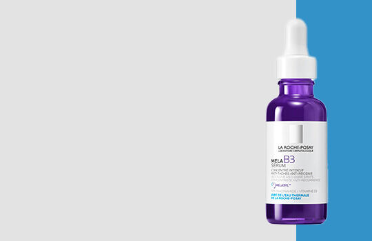 A dropper bottle of skincare serum with a purple tint, set against a split background of light gray and bright blue.