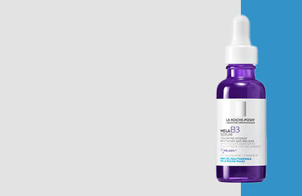 A dropper bottle of skincare serum with a purple tint, set against a split background of light gray and bright blue.