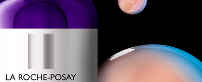 A close-up of two skincare products from La Roche-Posay: a blue serum labeled "HYALU B5" and a sunscreen labeled "ANTHELIOS 50+" displayed on a woven surface.
