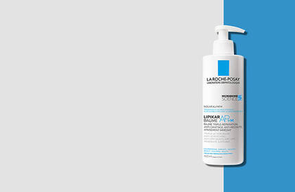 A bottle of La Roche-Posay liquid skincare product with a pump dispenser, set against a light gray and blue background.