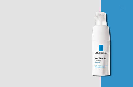 A bottle of La Roche-Posay Toleriane soothing lotion on a light gray and blue background.