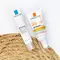 Two skincare products from La Roche-Posay are displayed: an Effaclar Duo SPF 30 and an Anthelios 50+ anti-imperfections cream. They are arranged on a textured surface, likely to emphasize their focus on skin protection and correction.