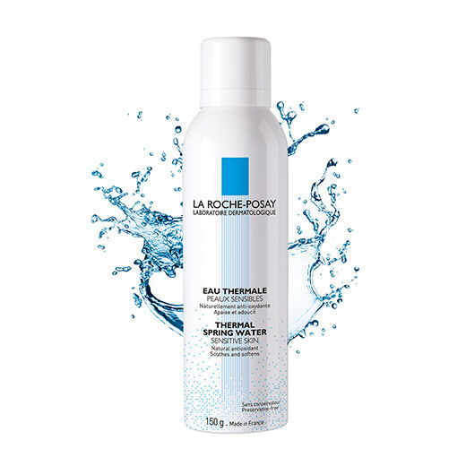 A canister of La Roche-Posay Thermal Spring Water, with a splash of water graphic in the background, emphasizing its soothing properties for sensitive skin.