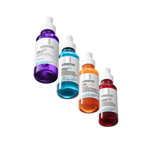 A vibrant assortment of La Roche-Posay serums, seemingly suspended in mid-air.​