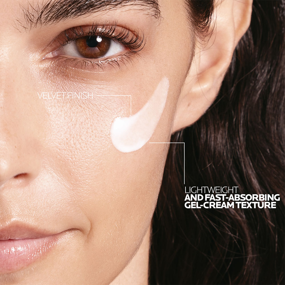 Close up texture shot of Anthelios UVMUNE 400 Invisible Fluid SPF50+ - a creamy, off-white formula.