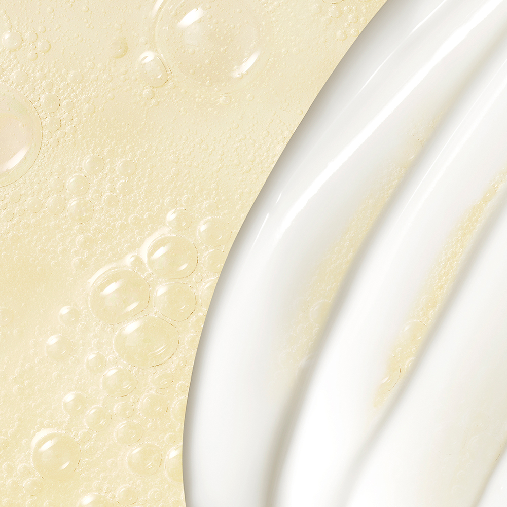 Close up texture of a bubbly Lipikar wash, and creamy Lipikar lotion