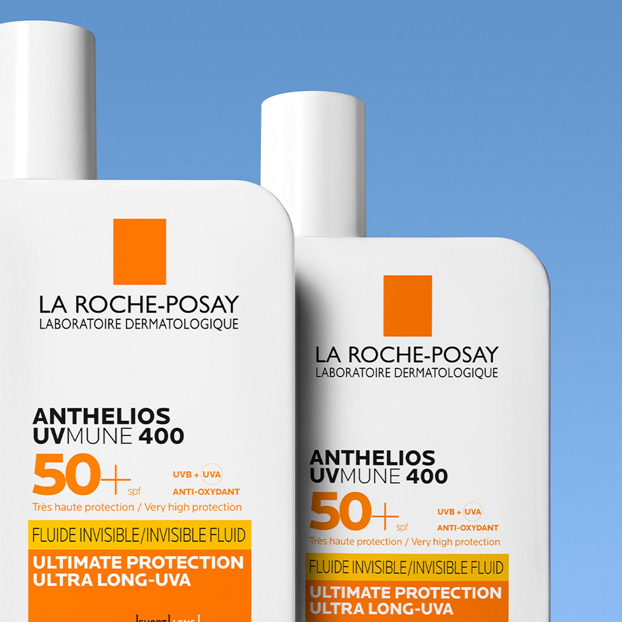 2 bottles of Anthelios UVMune Invisible Fluid SPF50+ standing against a blue background