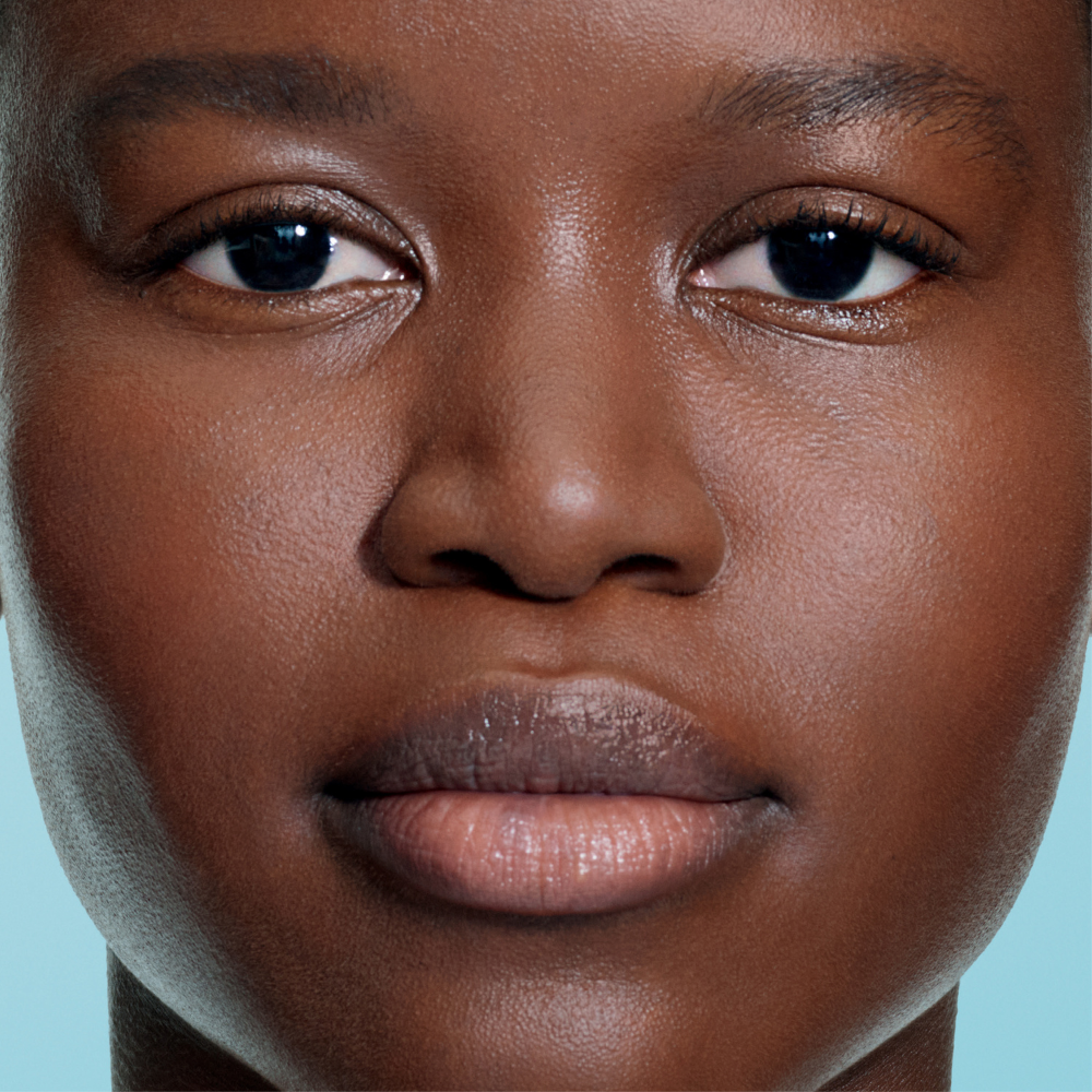 A woman's face with bright under-eyes